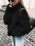 Black chunky knit turtleneck sweater with long sleeves and ribbed collar