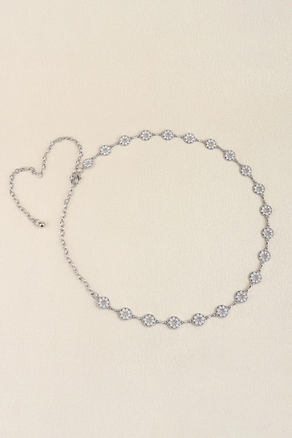 Silver rhinestone chain belt with heart-shaped end detail