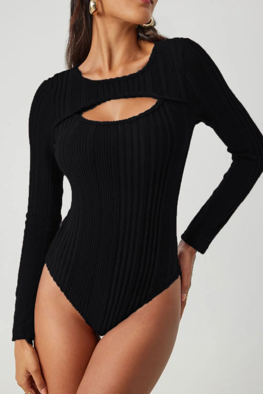 Black ribbed knit bodysuit with long sleeves and round cutout at neckline