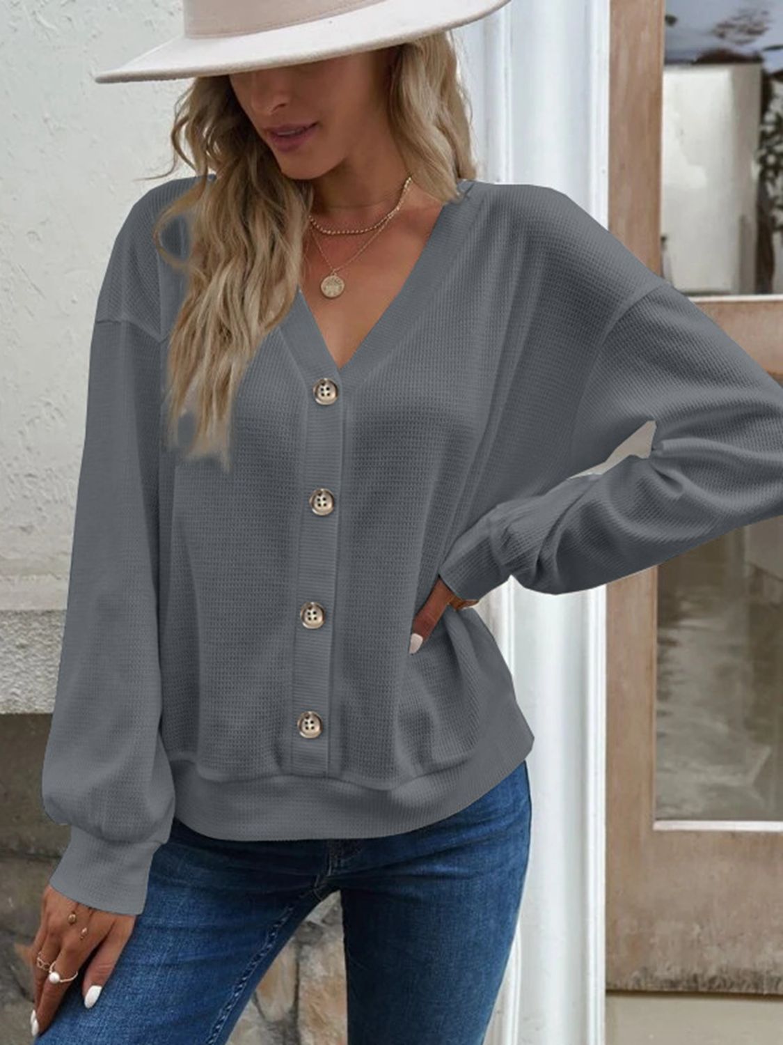 Dark gray blouse with V-neck, dropped shoulders, button front, long sleeves