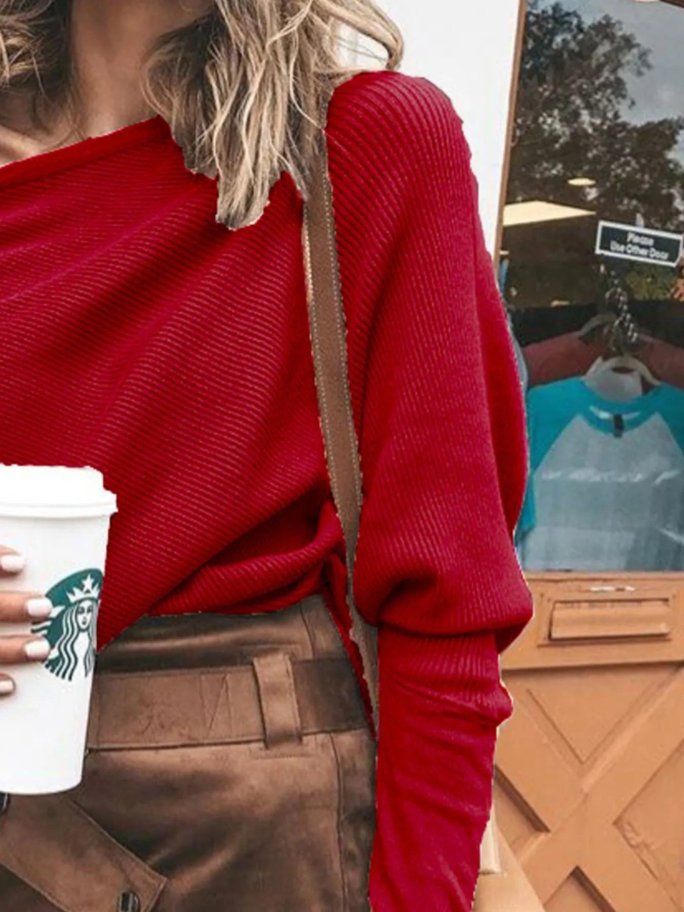 Red one-shoulder ribbed knit sweater with draped off-shoulder neckline.