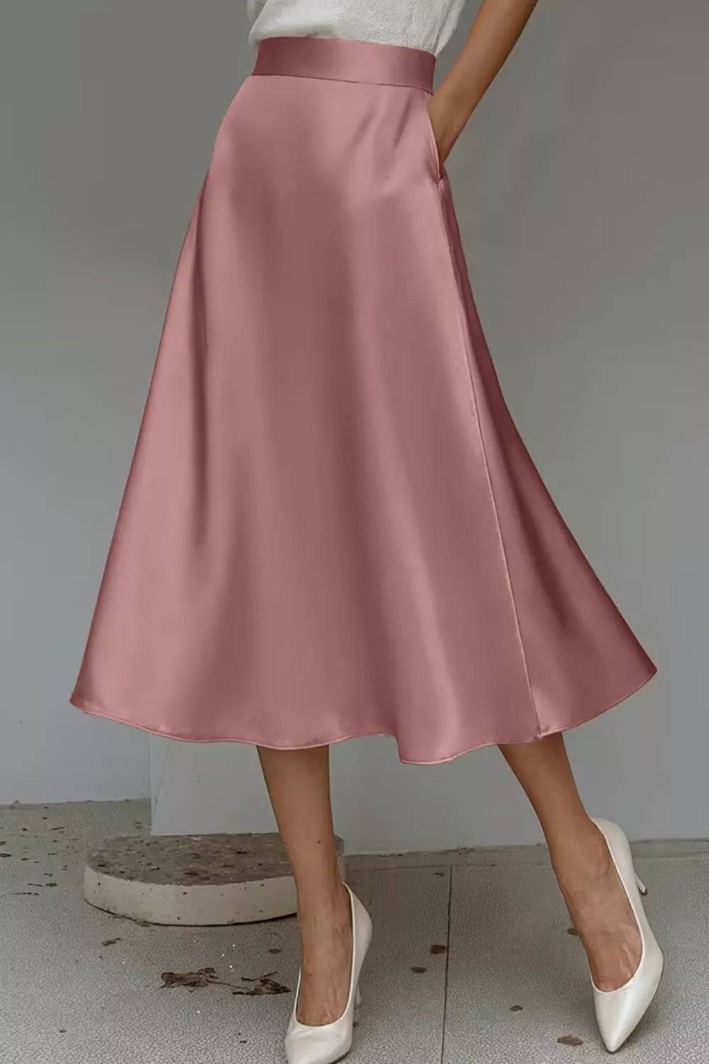 Satin A-line midi skirt in dusty pink with smooth drape and side pockets