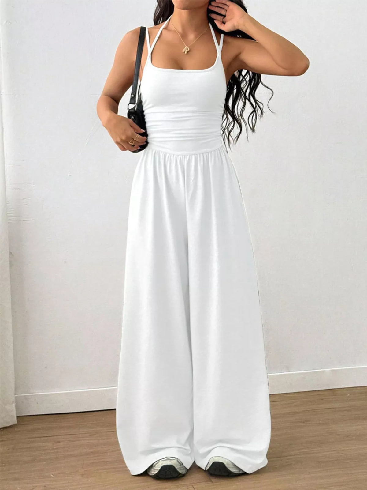 White ruched spaghetti-strap wide-leg jumpsuit with gathered waist, sleeveless