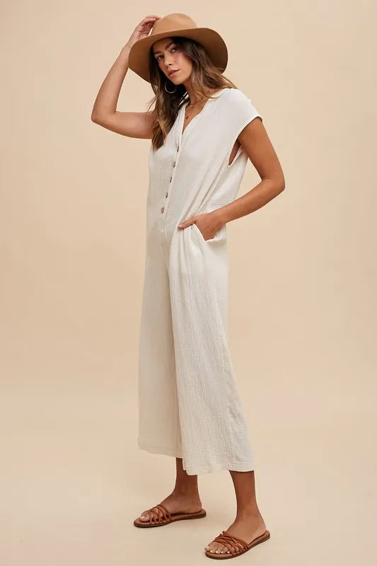 Cream button-front jumpsuit with V-neck and wide legs