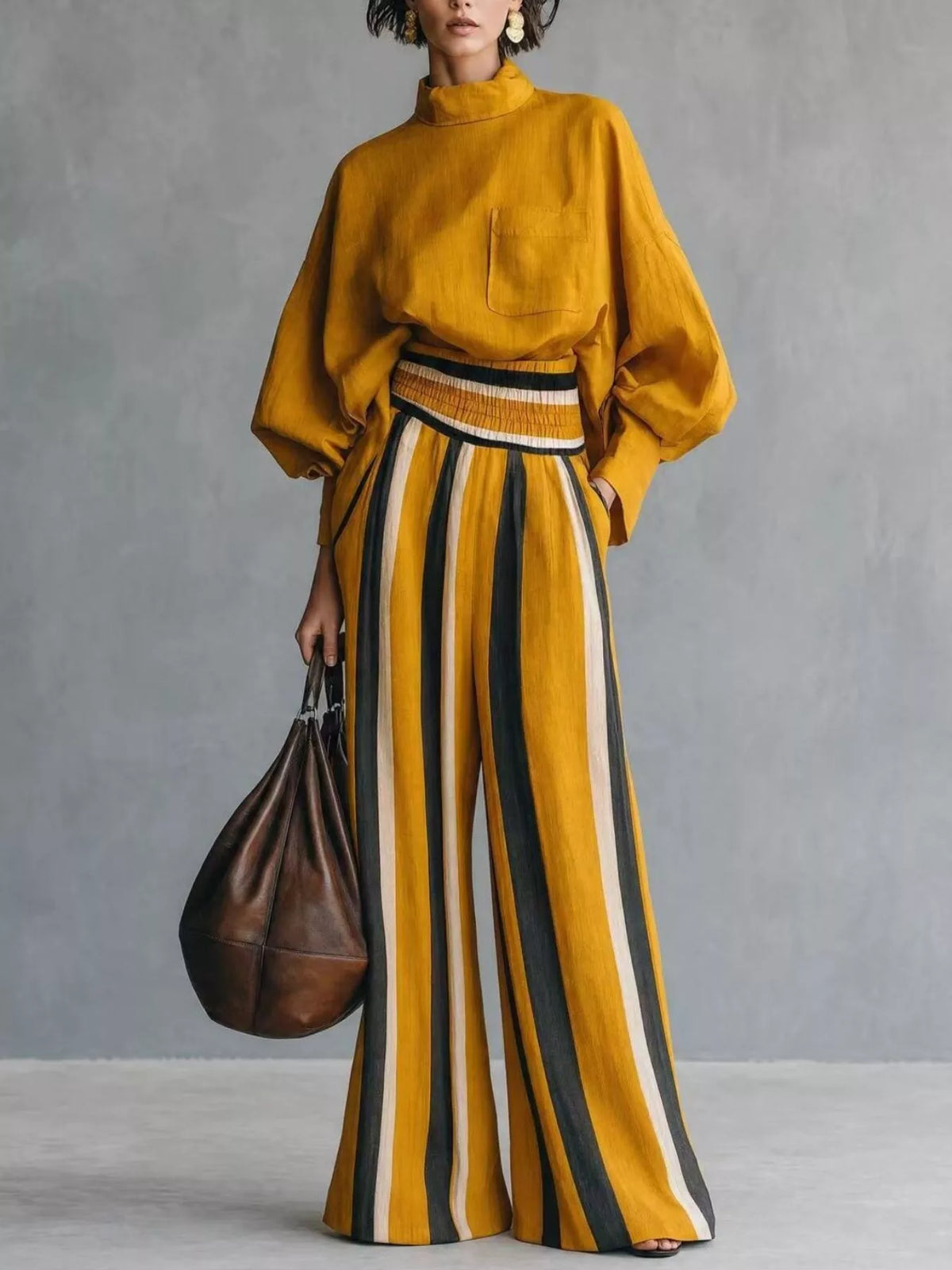 Mustard mock-neck blouse with pocket, paired with striped maxi skirt