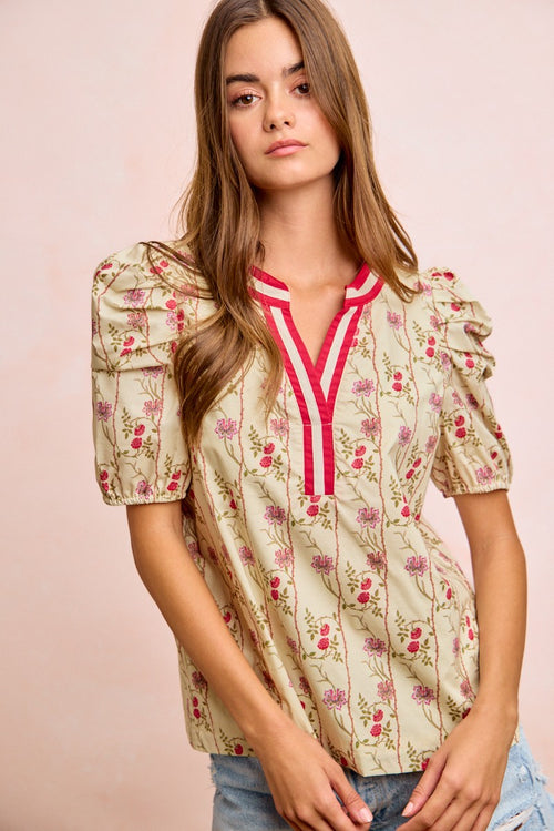 Cream floral blouse with red trim V-neck and puff gathered sleeves