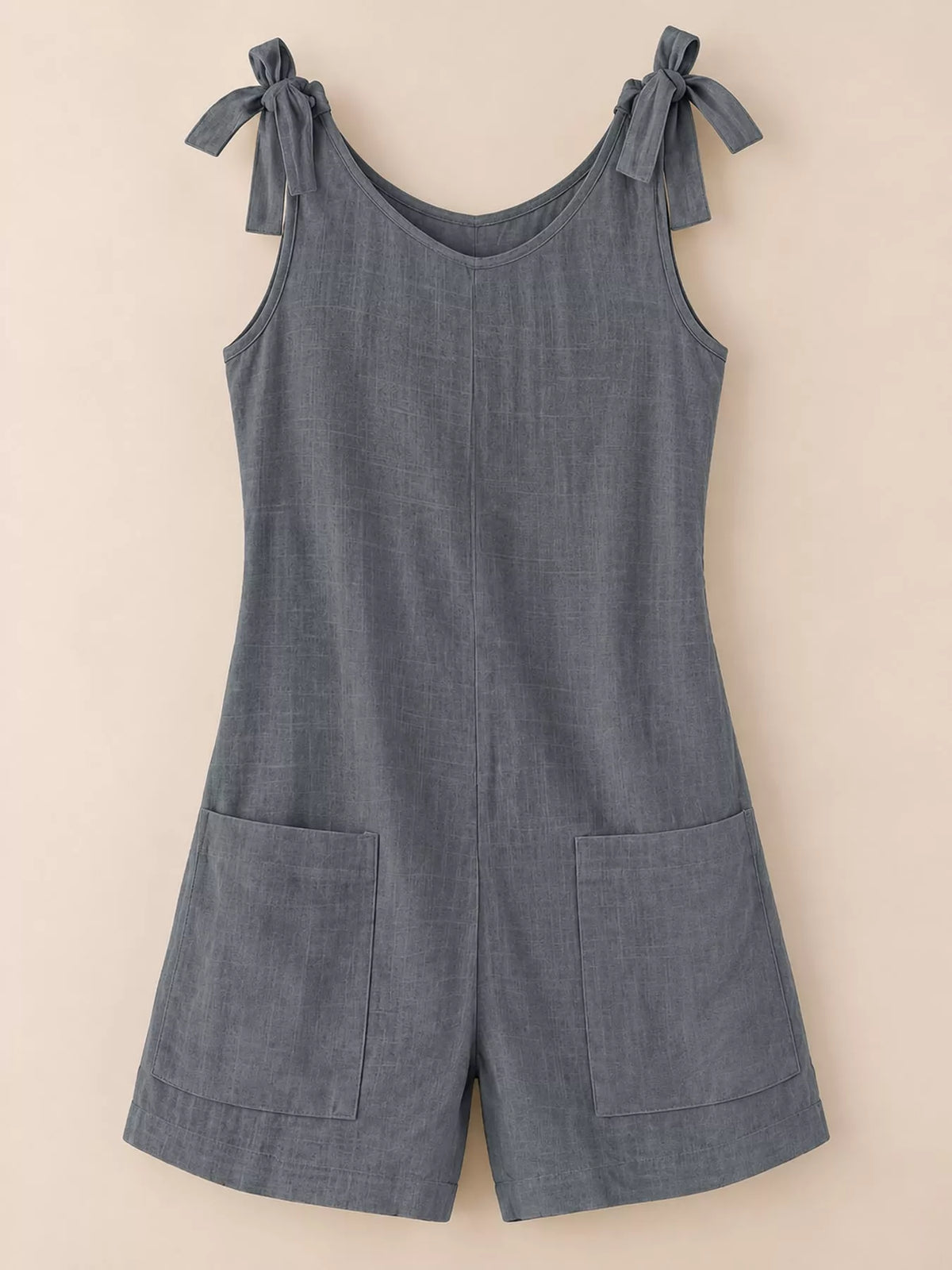 Dark blue tie-shoulder bow romper with front pockets and wide-leg shorts