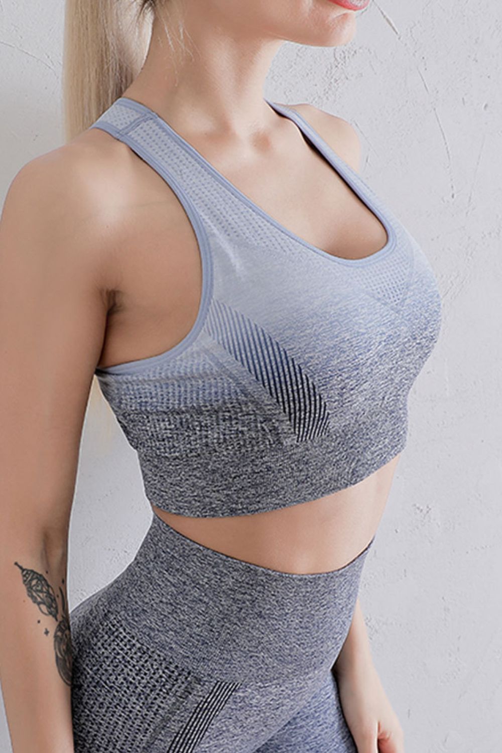 Sports bra and leggings set close-up: grey textured sports bra and matching leggings