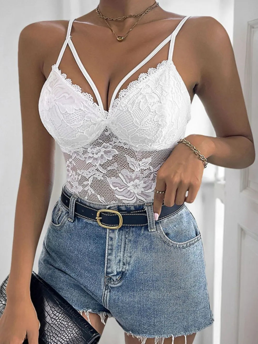 White lace spaghetti strap bodysuit with V-neck and scalloped floral cups