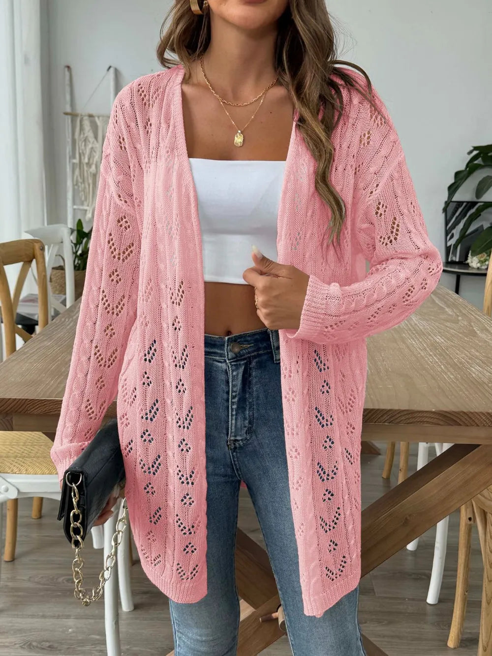 Pink open-front long-sleeve cardigan with lace openwork knit pattern and soft drape.
