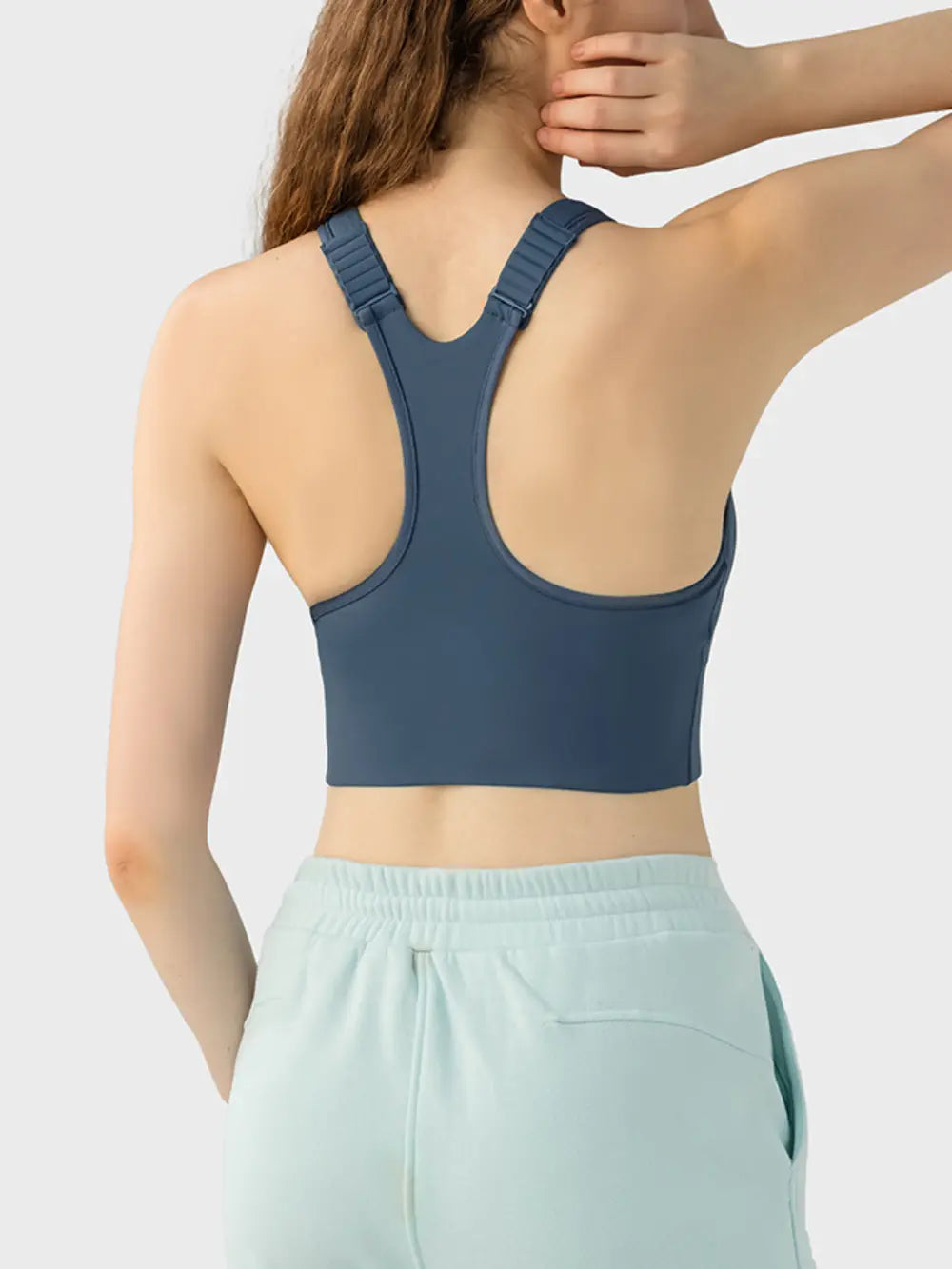Dark blue sport bra back view with wide straps and racerback