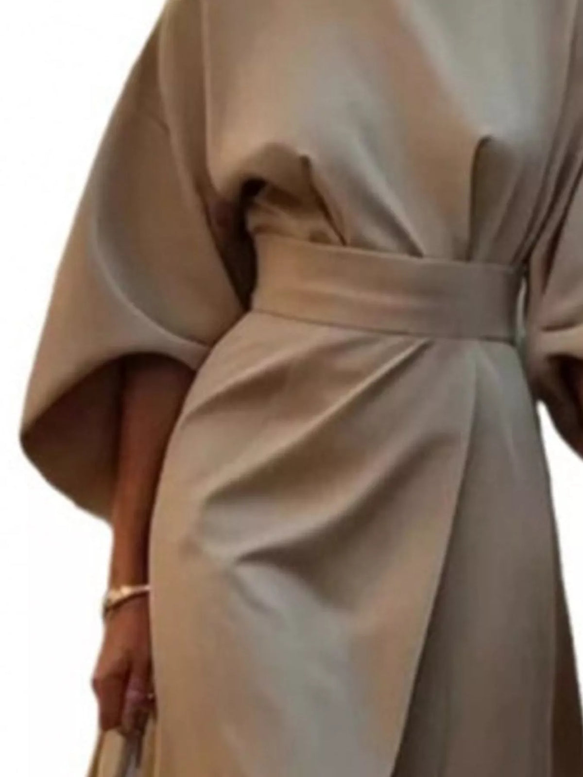 Khaki belted midi dress close-up: kimono sleeves and gathered high-waist twist