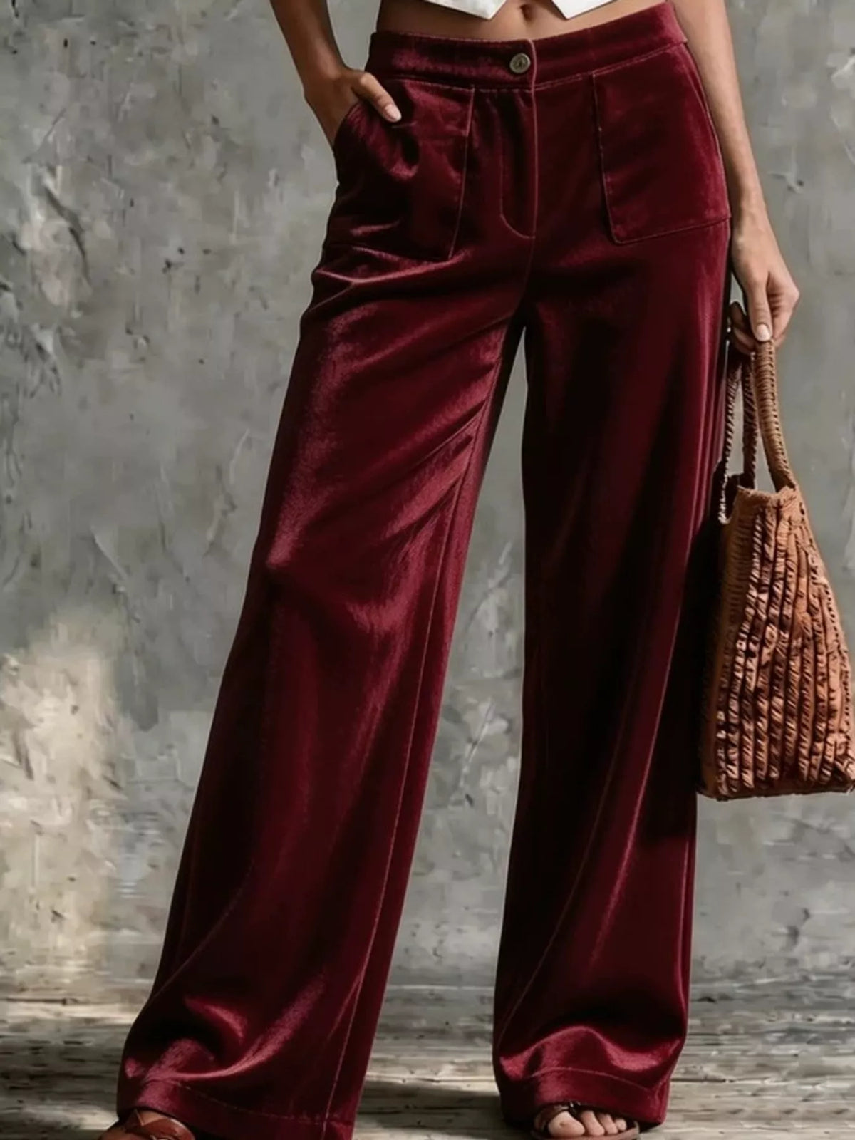 Wine red velvet wide-leg pants with high waist, button closure, and side pockets