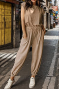Khaki drawstring jumpsuit with round neck and cap sleeves, cinched waist