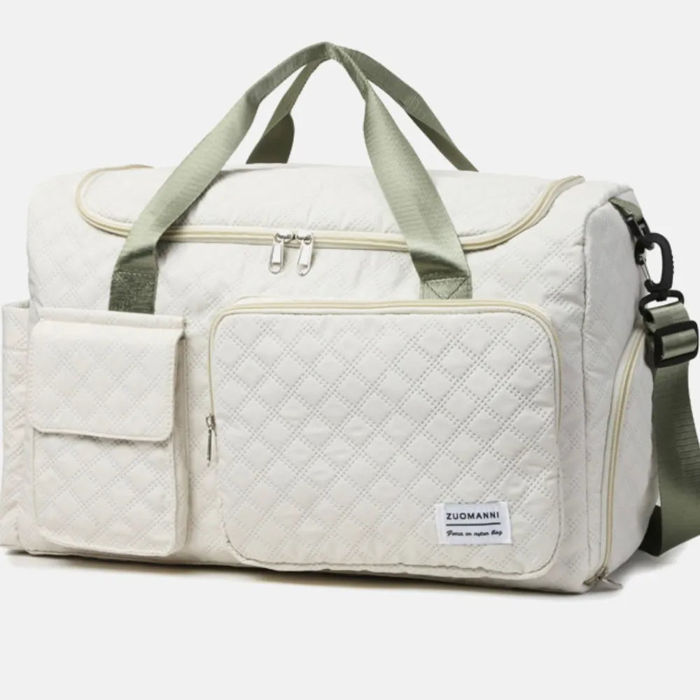 White duffel travel bag with front pocket panel, top handles, and zipper closure