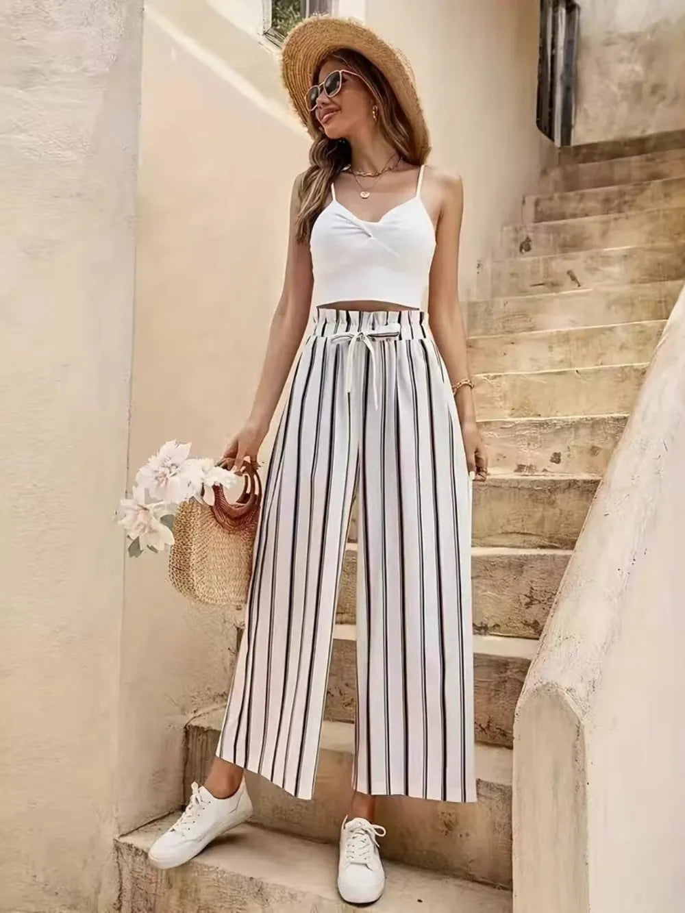 Striped wide-leg pants with elastic waistband and tie, loose vertical black-and-lavender stripes