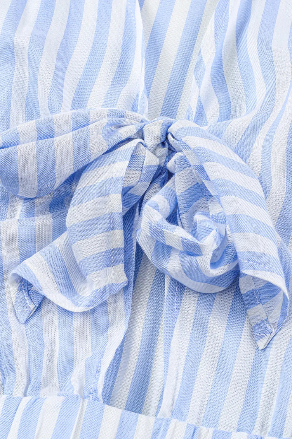Striped romper waist with ruched fabric and large bow-tie, light blue