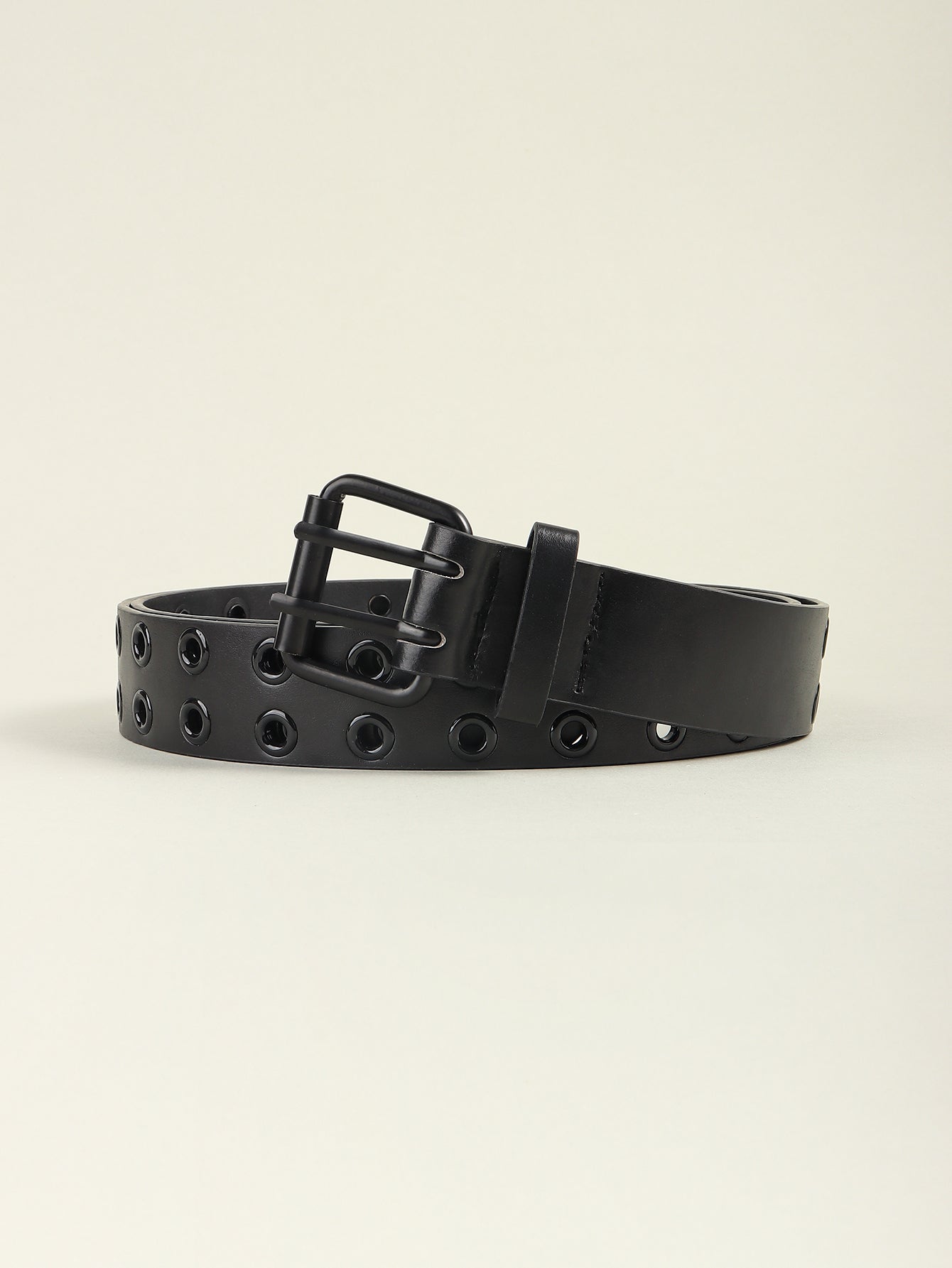 Black grommet belt with square buckle and wide strap, shown from side angle.