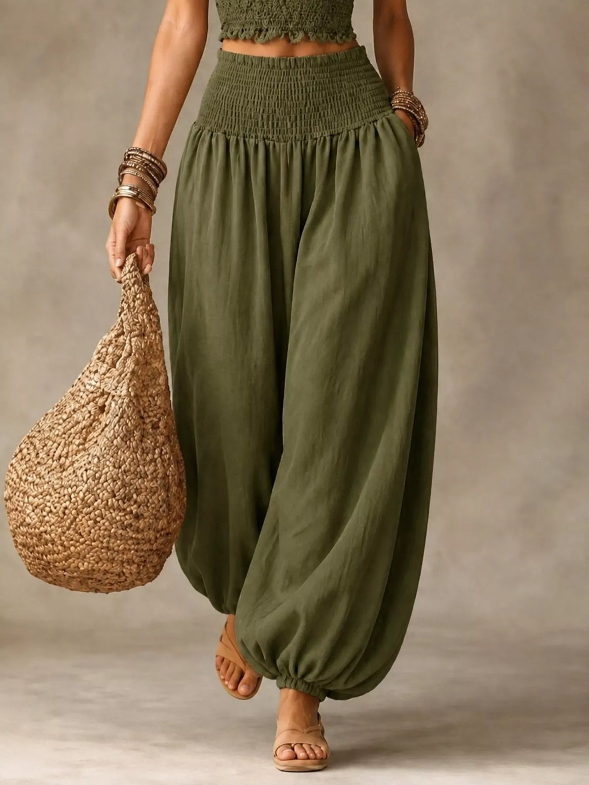 Army green elastic-waist smocked harem pants with loose fit and gathered cuffs