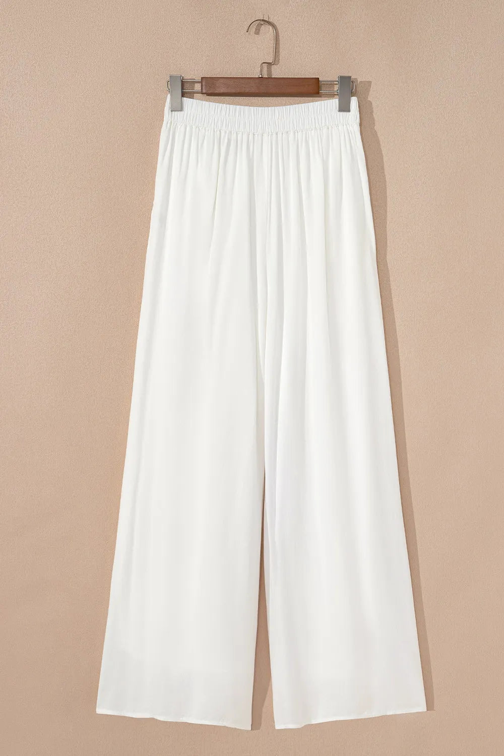 White wide-leg pants with pleated front and drawstring elastic waist, relaxed fit