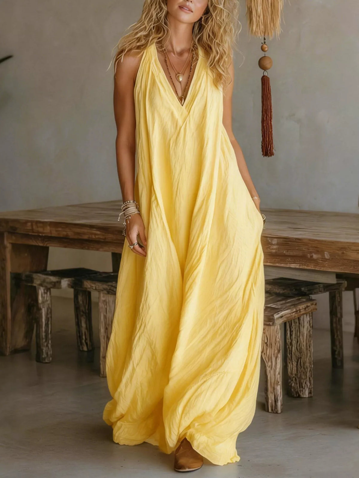 Yellow sleeveless V-neck flowy maxi dress with gathered, airy skirt