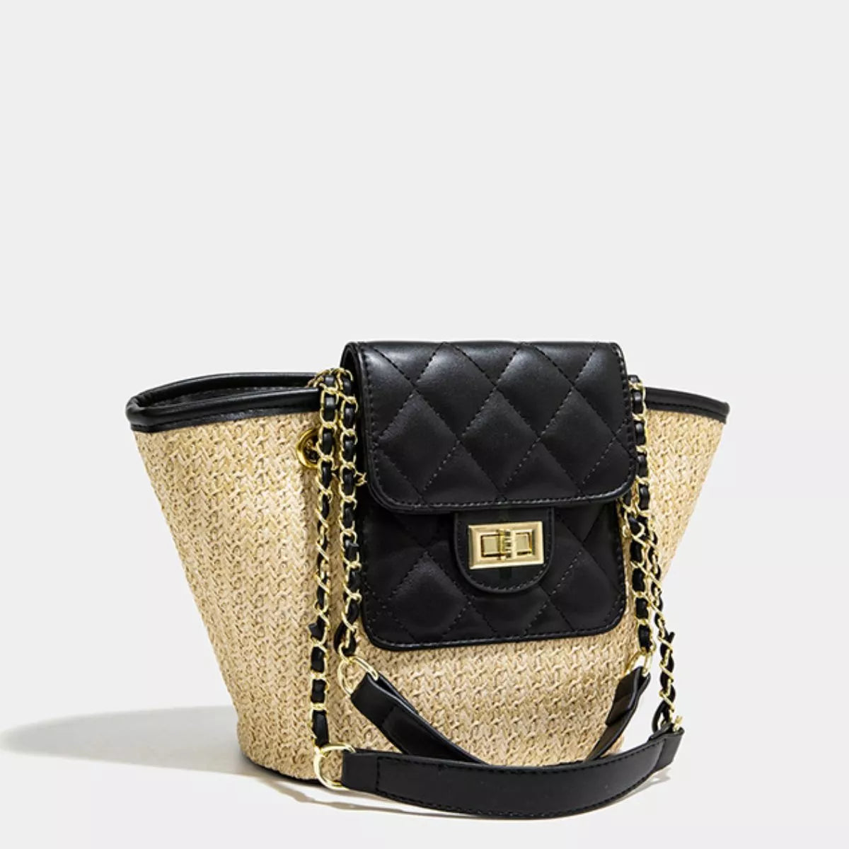 Woven straw bucket-style tote with black quilted front pocket and chain strap
