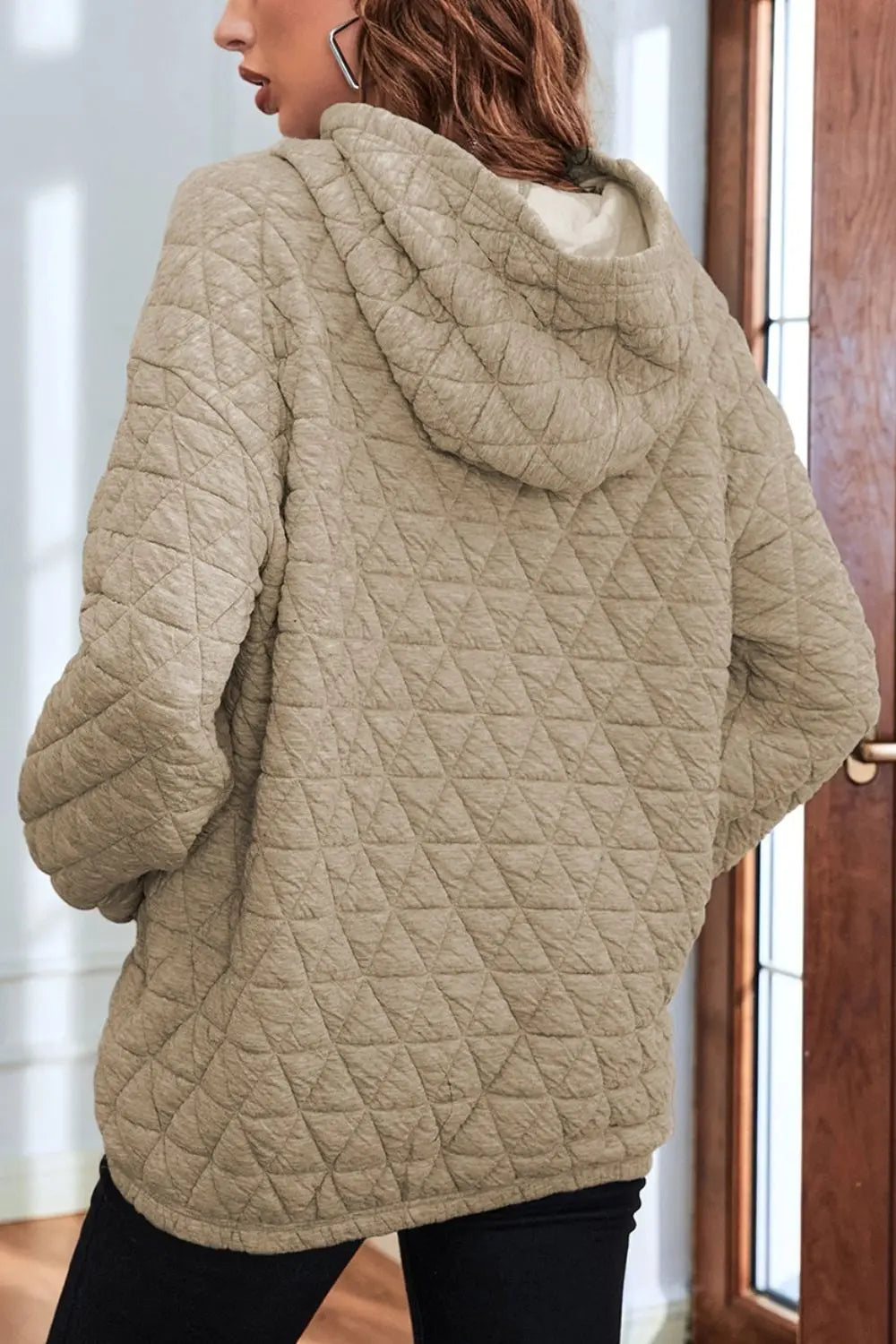 Khaki quilted long-sleeve hoodie, back view, with hood and front pocket