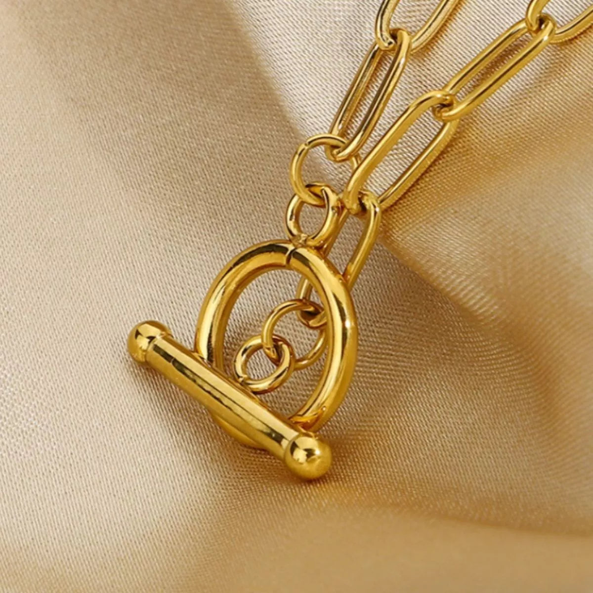 Gold heart toggle clasp on chain link necklace