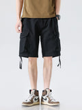 Men's black drawstring wide-leg cargo shorts with flap cargo pockets and leg ties