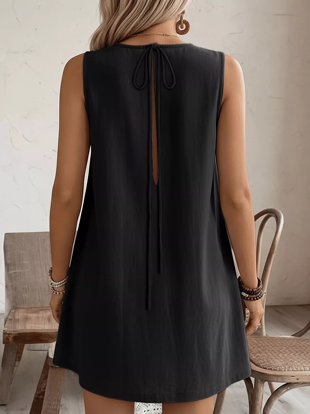 Cedar & Moore Frill Sleeveless Round Neck Dress in black with back tie and keyhole opening