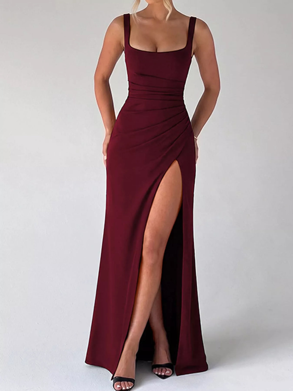 Burgundy ruched evening maxi dress with thin straps and front leg slit