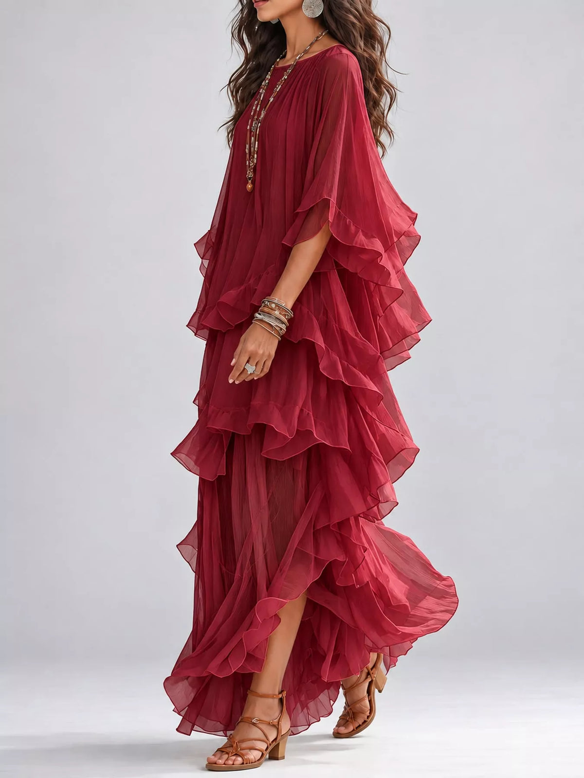 Burgundy tiered maxi dress with layered ruffle design and flowing flutter sleeves
