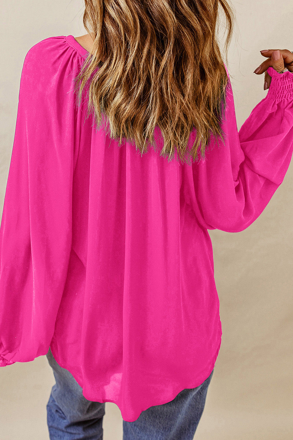 Hot pink lantern sleeve blouse with V-neck, full sleeves, and gathered cuffs
