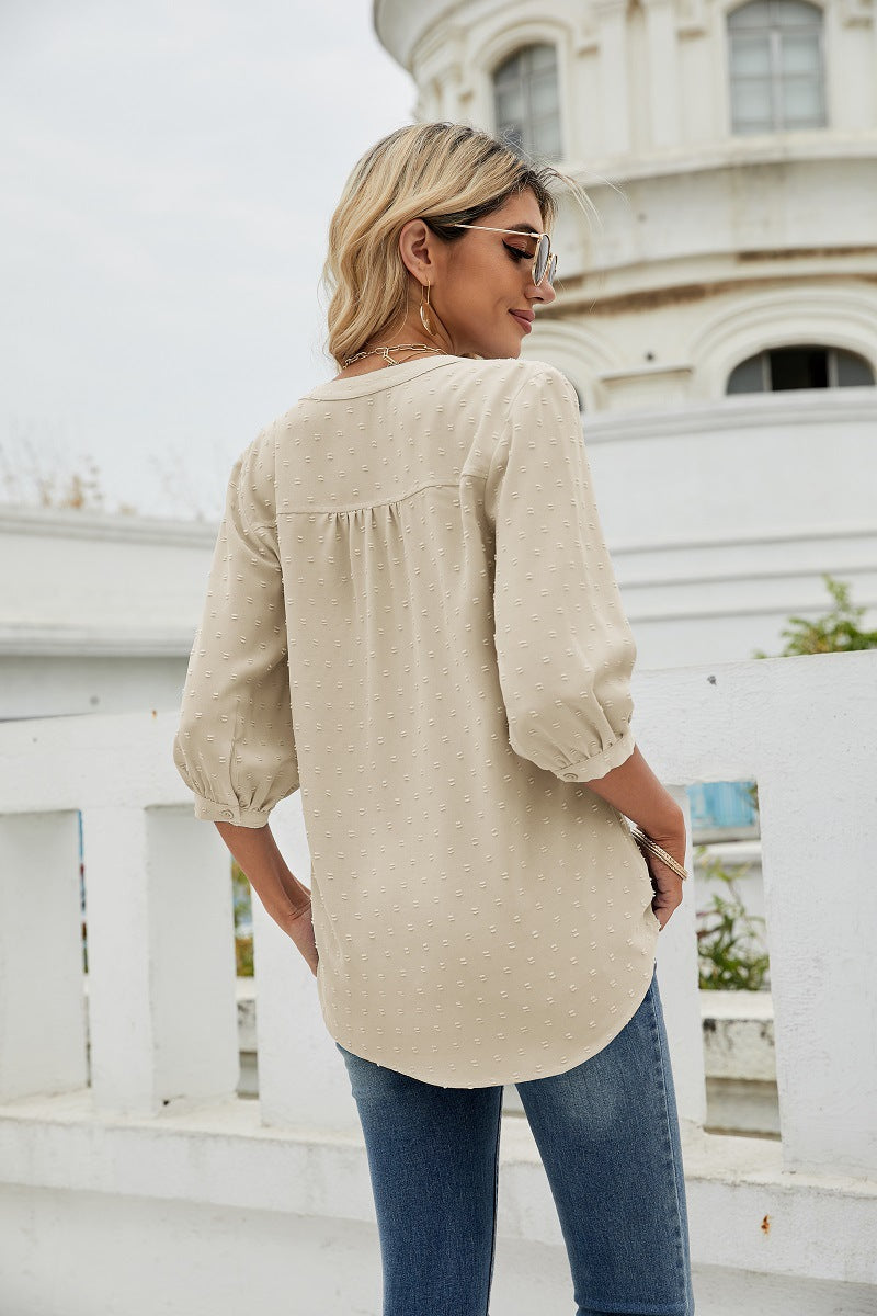 Cream swiss dot notched-neck blouse with gathered yoke and 3/4 sleeves, back