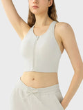 Ivory wide-strap sport bra with full-length front zipper