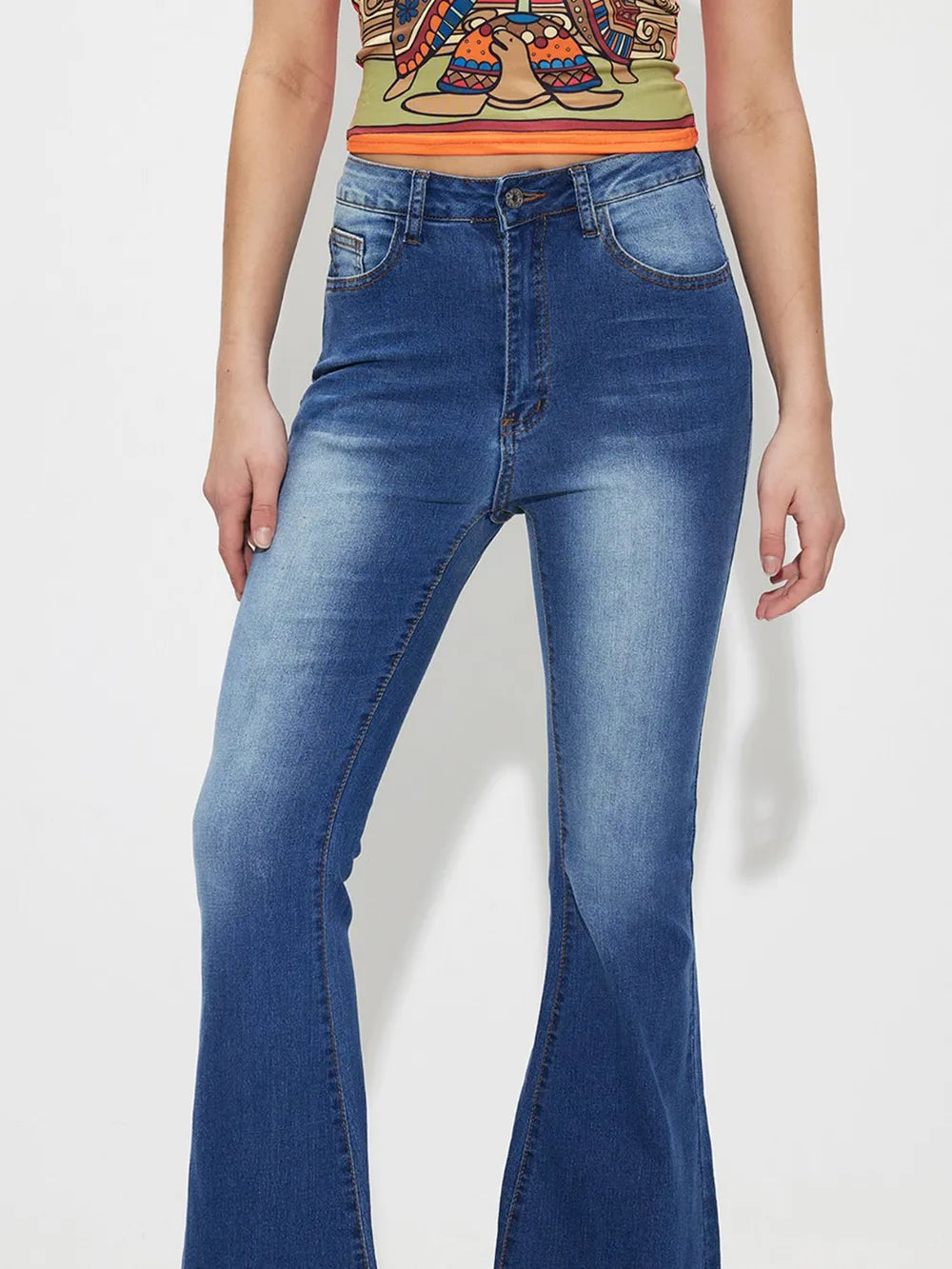 Mid-rise bootcut jeans, medium blue wash, button waistband and front seams