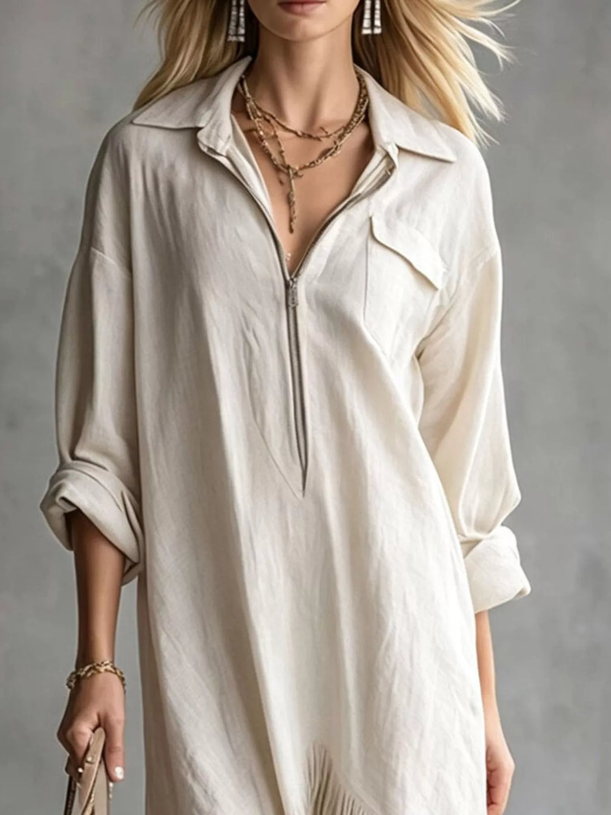 White midi dress with quarter-zip front and fringe hem detail