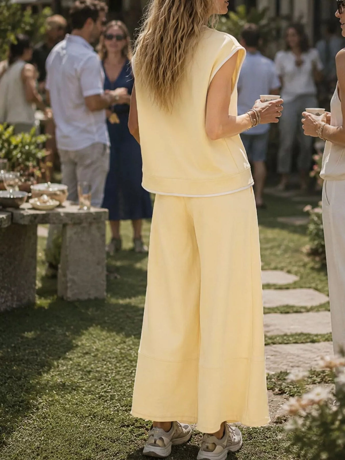 Light yellow sleeveless top and wide-leg crop pants set, side view, drawstring waist