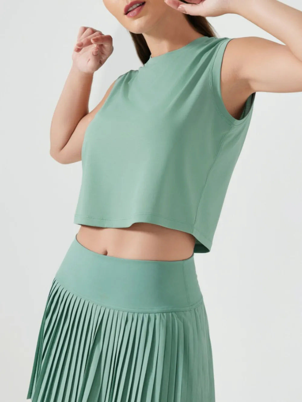 Millennia cropped active tank, sleeveless with round neck, teal green (side view).