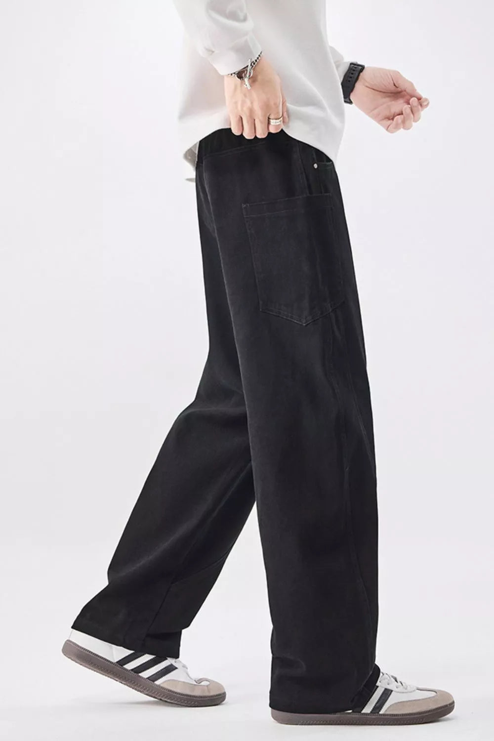 Men's black cotton jeans with drawstring waist and front patch pockets