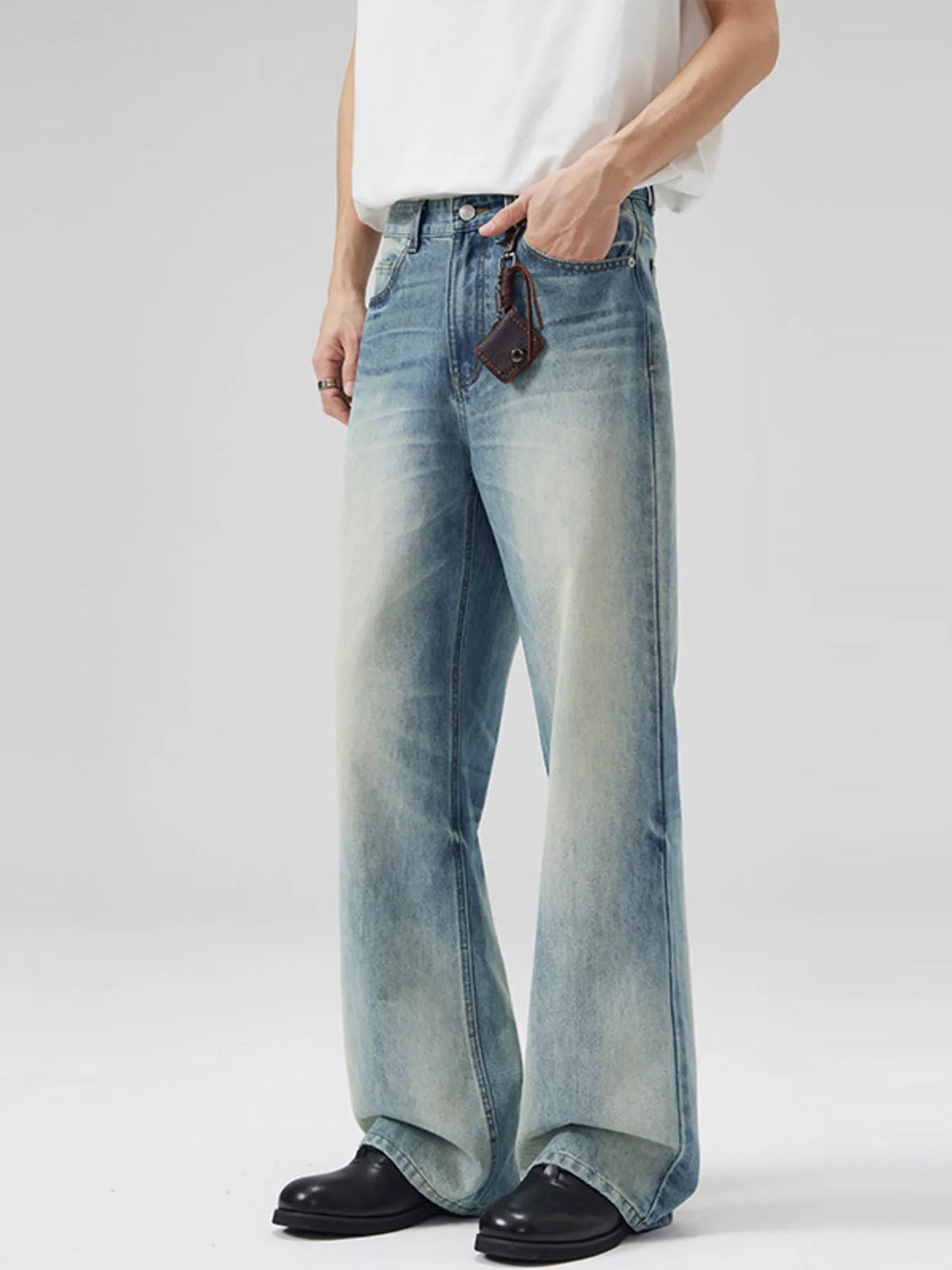 Light blue vintage wash wide-leg jeans with belt loops and front pockets