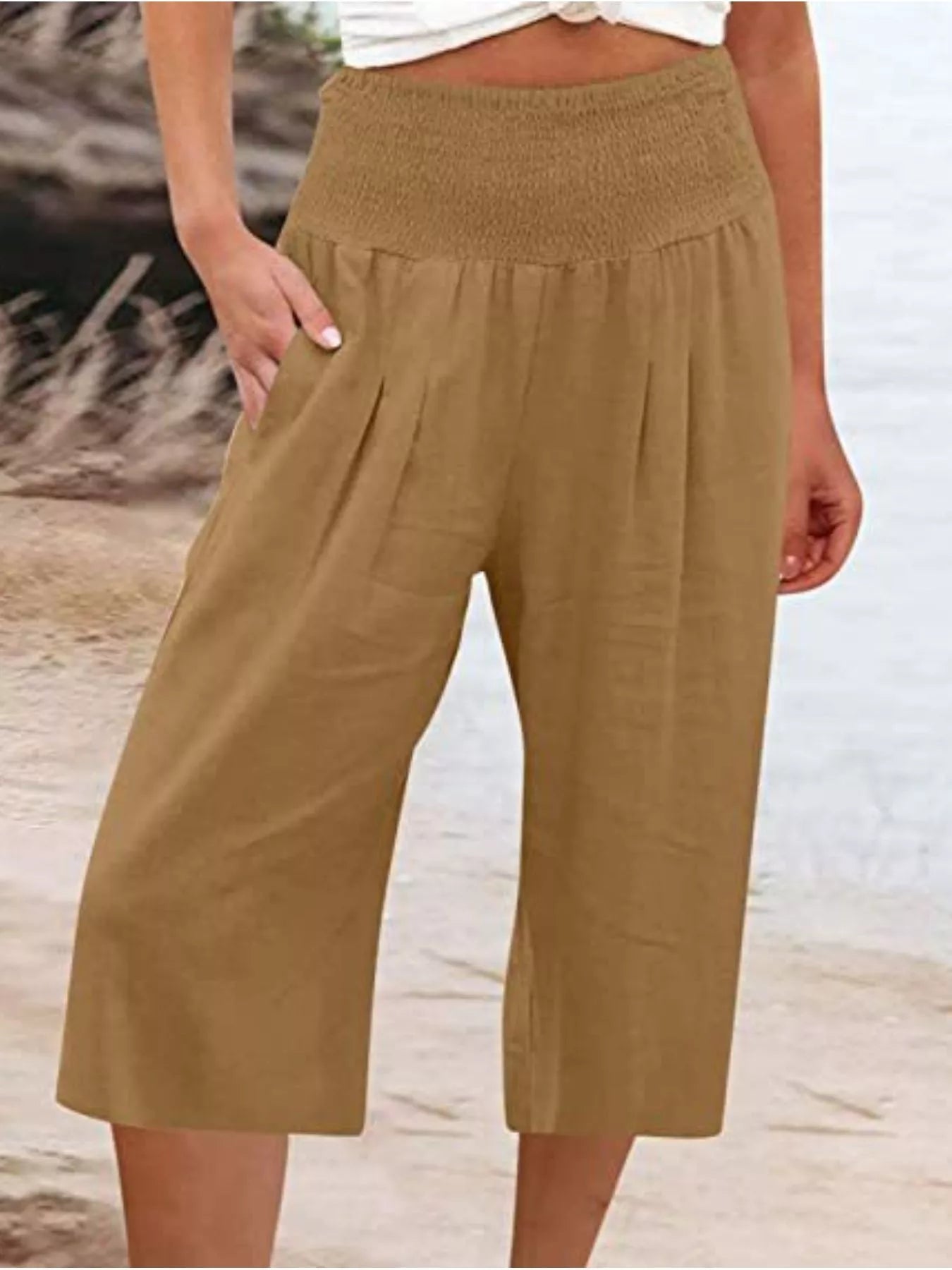 Tan smocked wide-leg capri pants with side pockets and elastic waistband