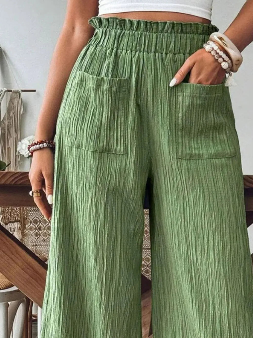 Frill wide-leg pants in green with ruched elastic waist and stitched side pockets