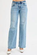 Medium-wash low-rise boyfriend jeans with ankle length and light distressing