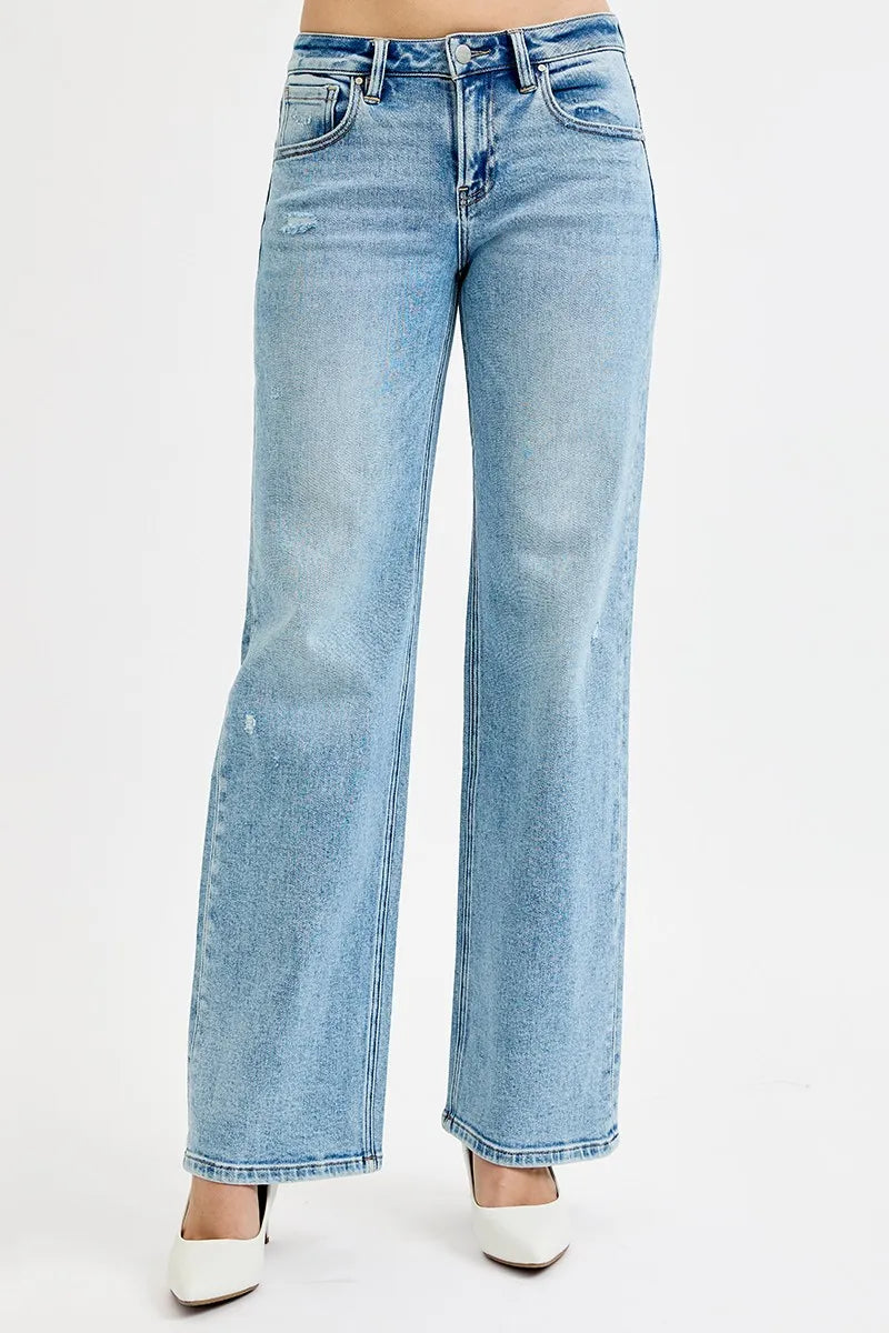 Medium-wash low-rise boyfriend jeans with ankle length and light distressing