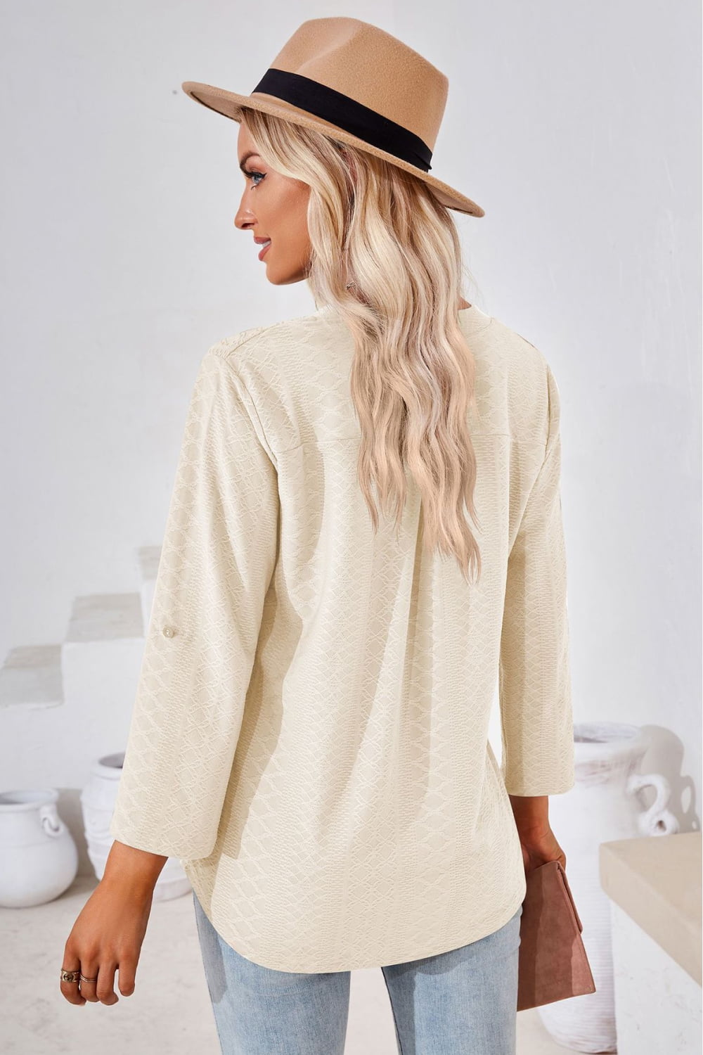 Ivory V-neck blouse with rolled sleeves and split neckline