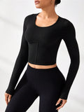 Black round-neck long-sleeve active t-shirt, cropped