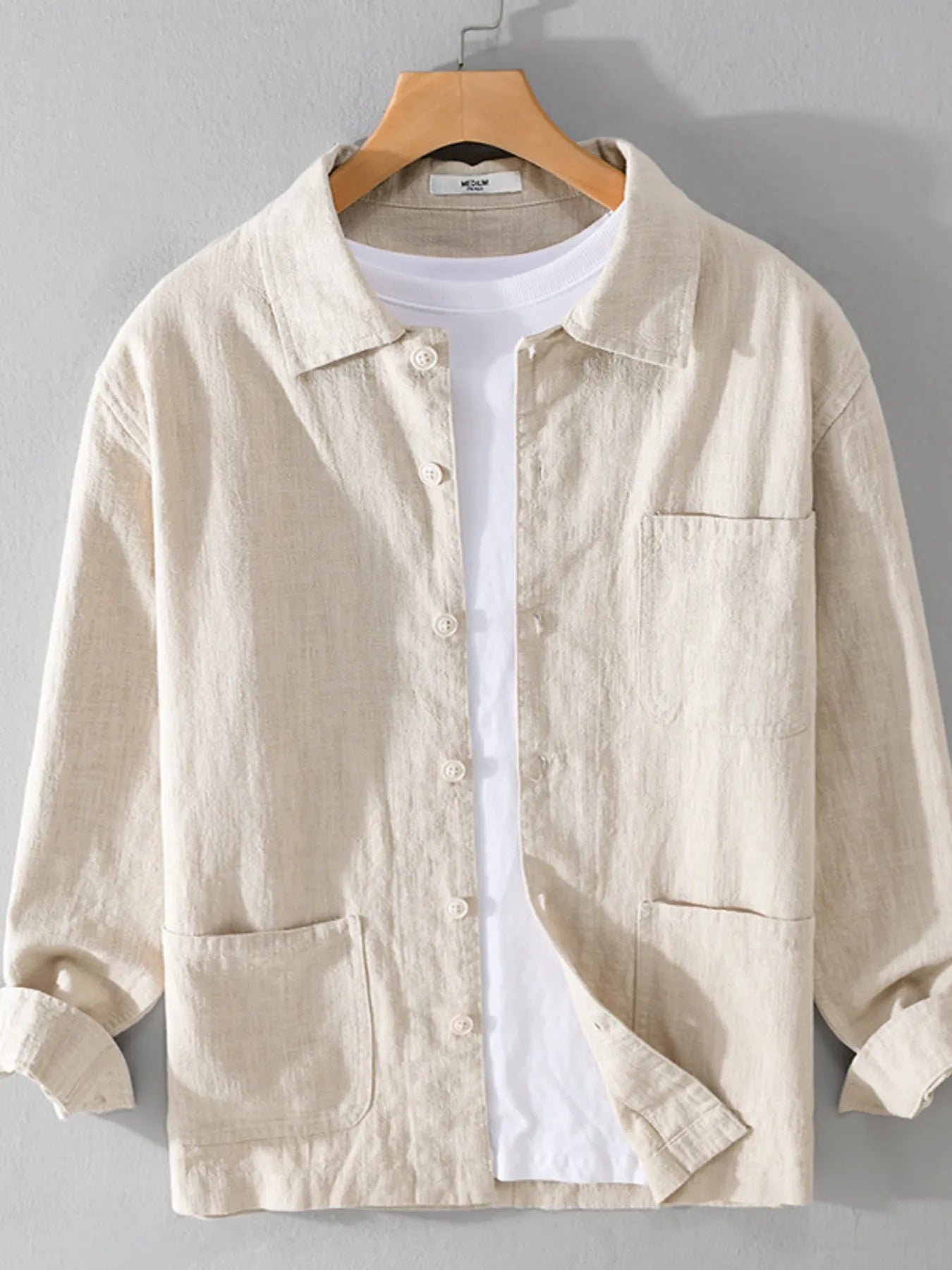 Light cream button-up shirt with chest pocket, button front, and long sleeves.