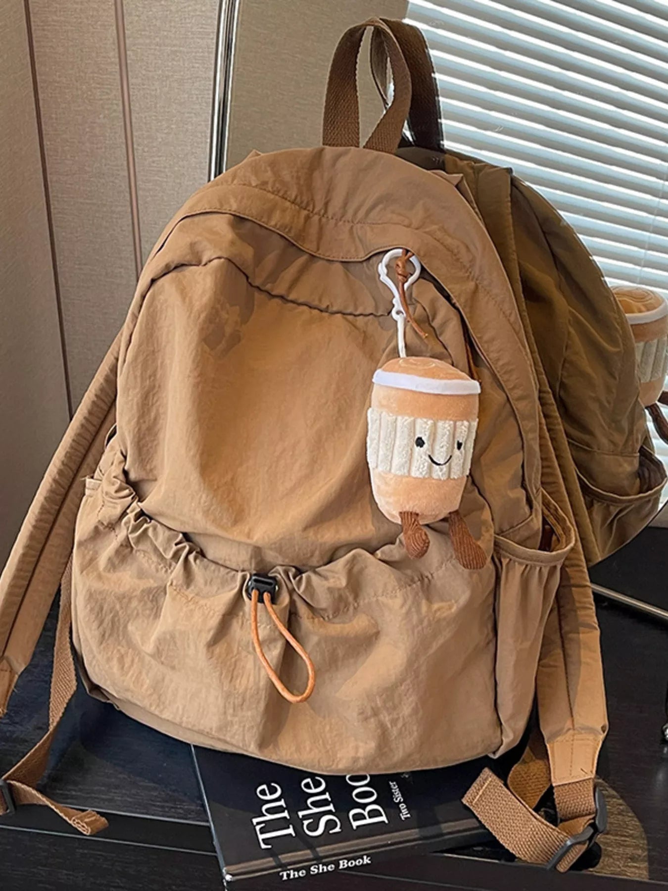 Cedar & Moore Casual lightweight nylon drawstring backpack bag, large tan with brown straps and a plush pouch charm