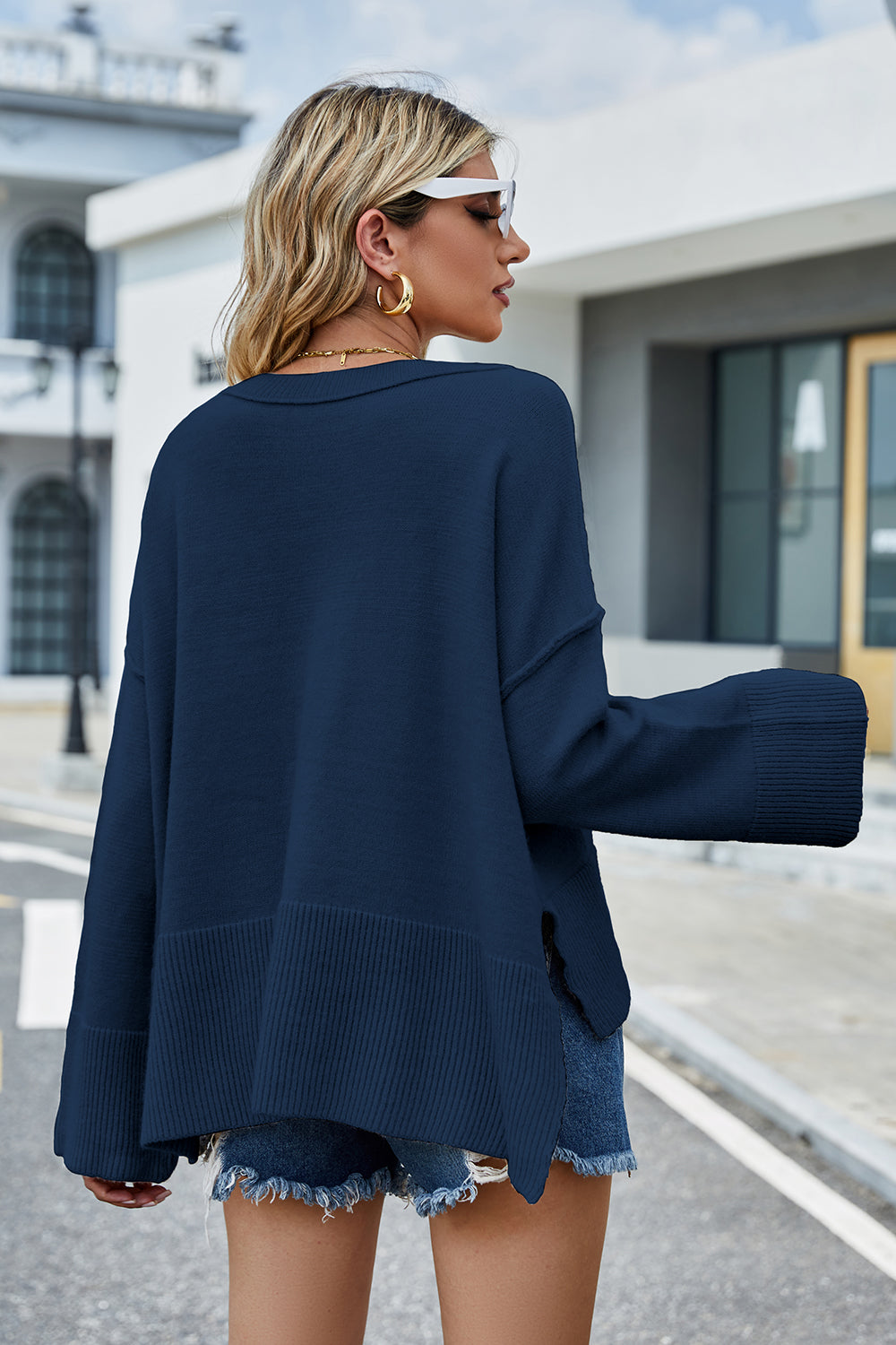 Peacock blue dropped-shoulder sweater back view with ribbed hem and cuffs